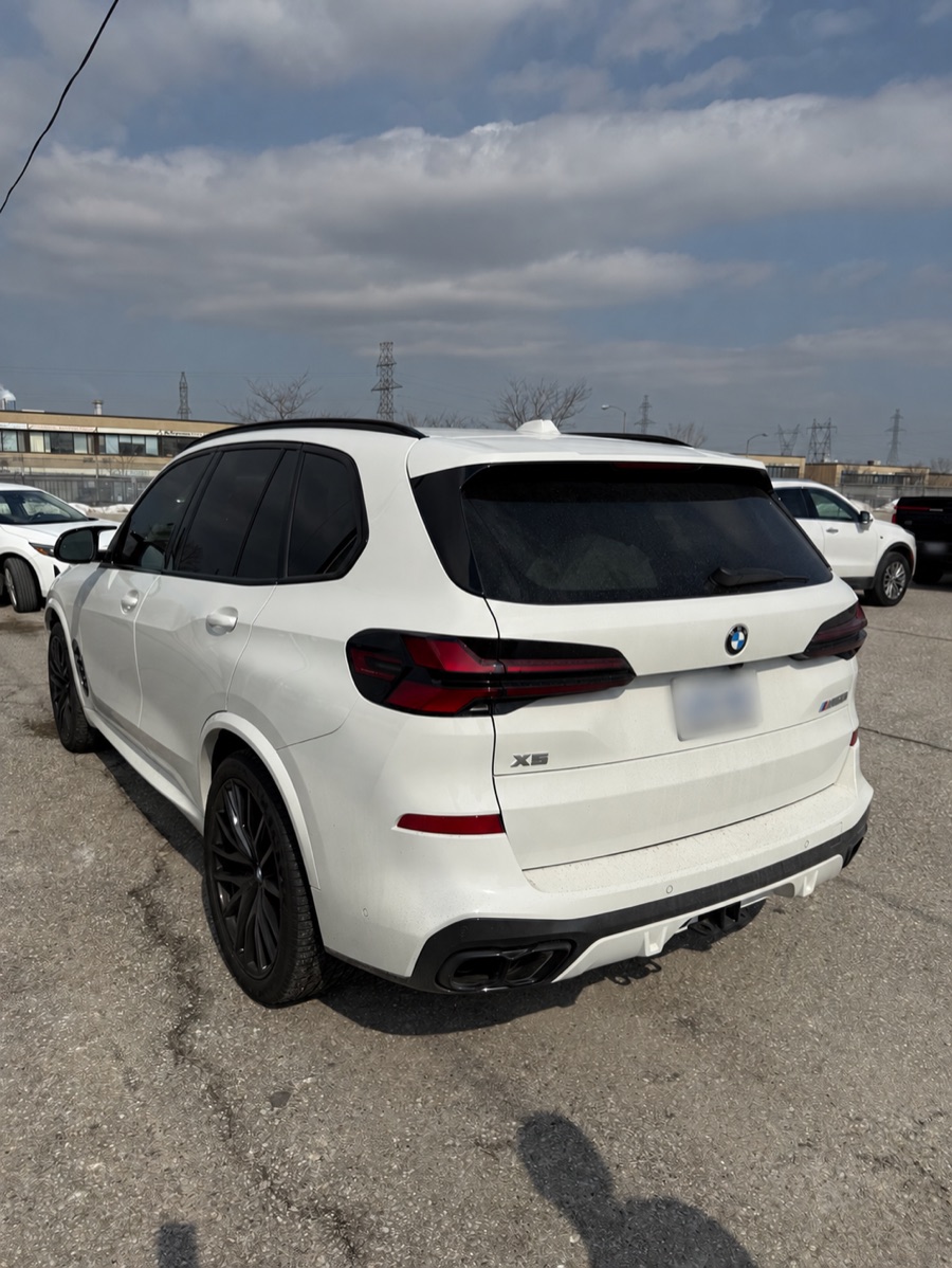 BMW photographed from the rear angle during terminal check-in